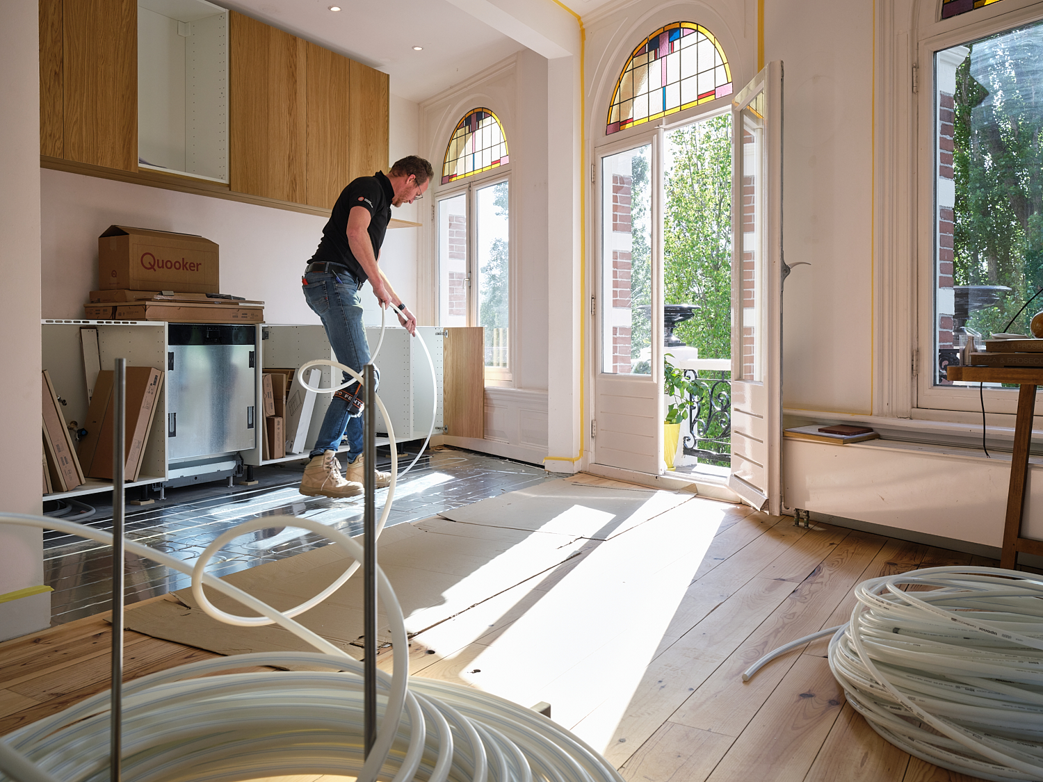 Droogbouw vloerverwarming op houten vloer: Uponor Siccus 16 in Amsterdams appartement